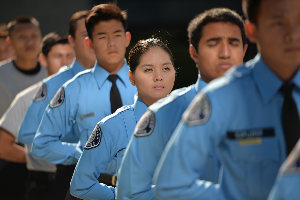 Westminster Police Explorers, including Explorer T. Nguyen, center, stand in formation for Dispatcher Cheryl Valle’s Walk of Honor. Photo by Steven Georges/Behind the Badge OC