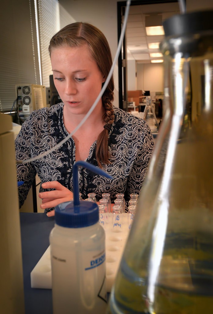 Emily Palmer, a forensic scientist in the OC Sheriff Department’s Forensic Alcohol Unit, prepares vials for a test run on one of their gas chromatography instruments used for analytical chemistry. Photo by Steven Georges/Behind the Badge OC