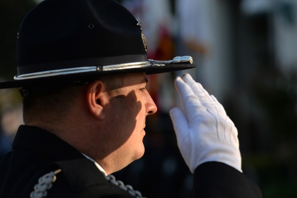 The Tustin PD Honor Guard, salutes during the Wally Karp memorial ceremony. Photo by Steven Georges/Behind the Badge OC