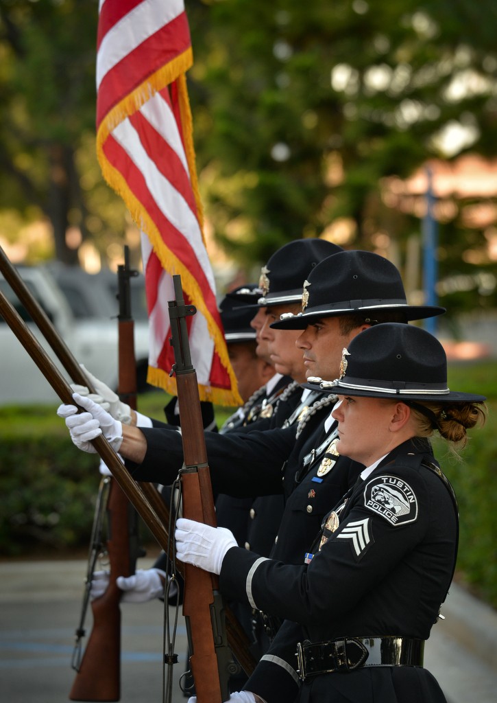 Tustin PD’s honor guard, including Sgt. Sara Fetterling, right, present the colors during the Wally Karp memorial ceremony at Tustin PD. Photo by Steven Georges/Behind the Badge OC