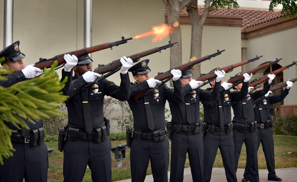 Tustin police officers fire off a 21-gun-salute (without projectiles) in honor of Wally Karp, the only Tustin police officer killed in the line of duty. Photo by Steven Georges/Behind the Badge OC