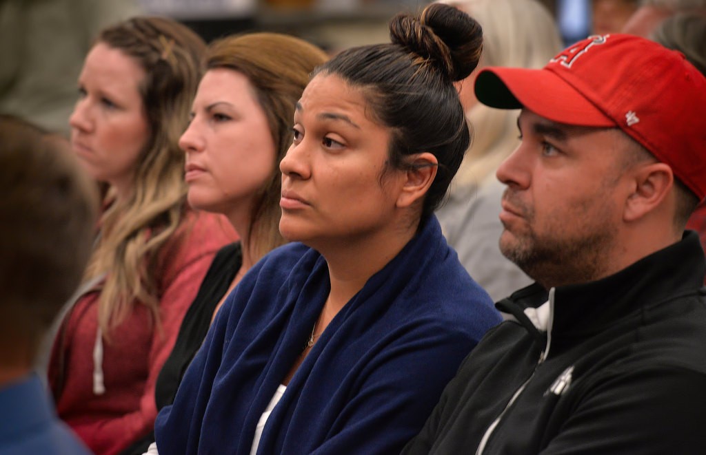 Jessica Nettles, center, and Brian Nettles, right, listen, to Anaheim PD officers talk during a community meeting at Crescent Elementary School, about the fatal shooting that occurred last week in Peralta Park. Photo by Steven Georges/Behind the Badge OC