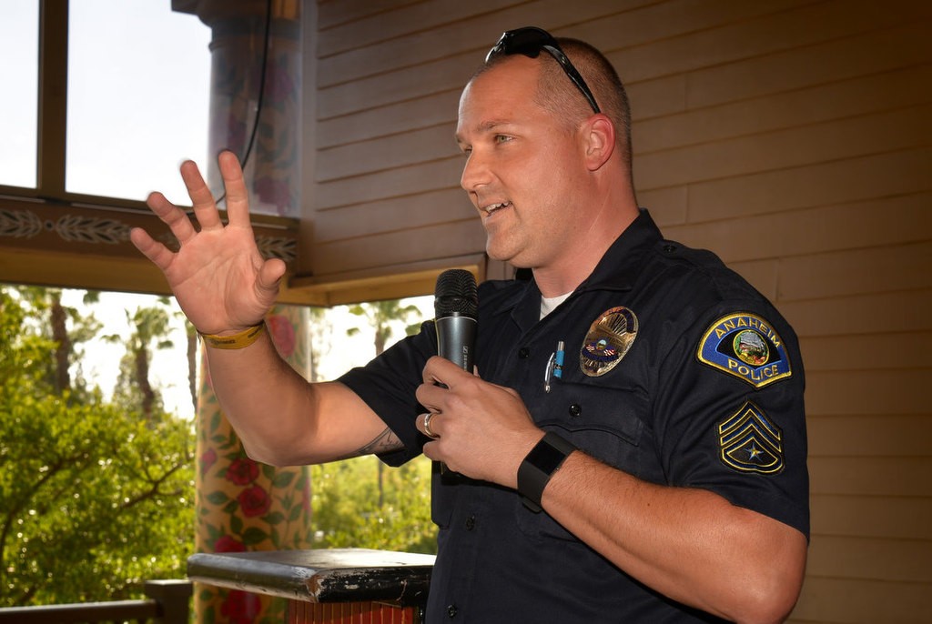 Anaheim PD Sgt. Brennan Leininger congratulates G.R.I.P. teachers during a recognition ceremony at the Anaheim House of Blues in Downtown Disney. Photo by Steven Georges/Behind the Badge OC