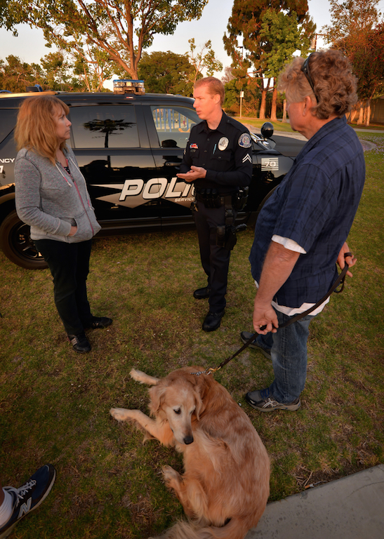 Westminster PD Cpl. Scott Gump talks to local dog owners at Bolsa Chica Park about the concept of the Pooch Patrol. Photo by Steven Georges/Behind the Badge OC