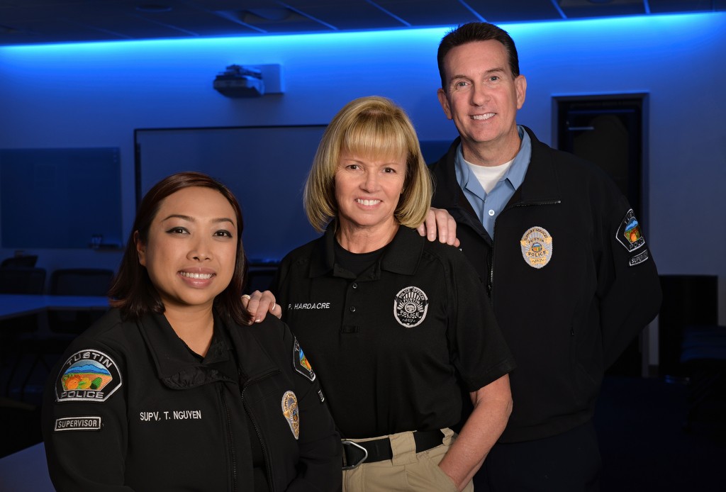 Members of Tustin PD's Peer Support team includes Thao Nguyen, records supervisor, left, Det. Pam Hardacre and Dave Kanoti, property and evidence supervisor. Photo by Steven Georges/Behind the Badge OC