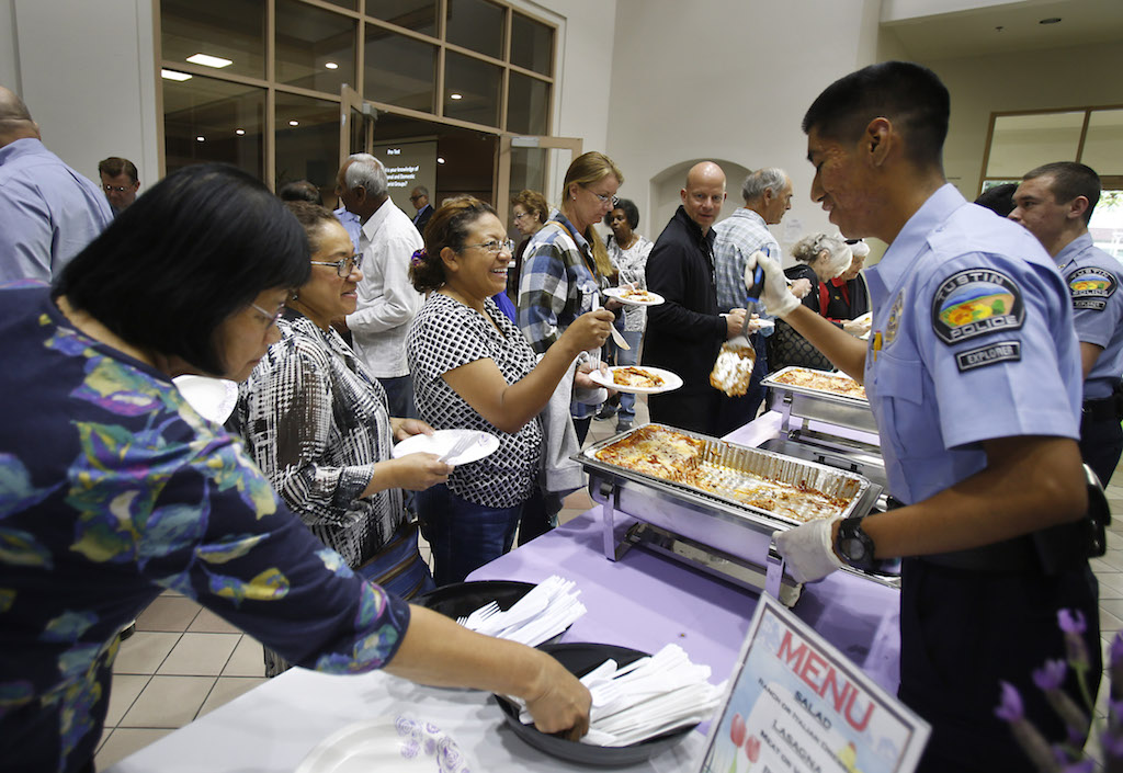 Tustin Police Explorers served dinner during the Tustin Police Departments' Block Captain's meeting for local residents. Photo by Christine Cotter/Behind the Badge OC 
