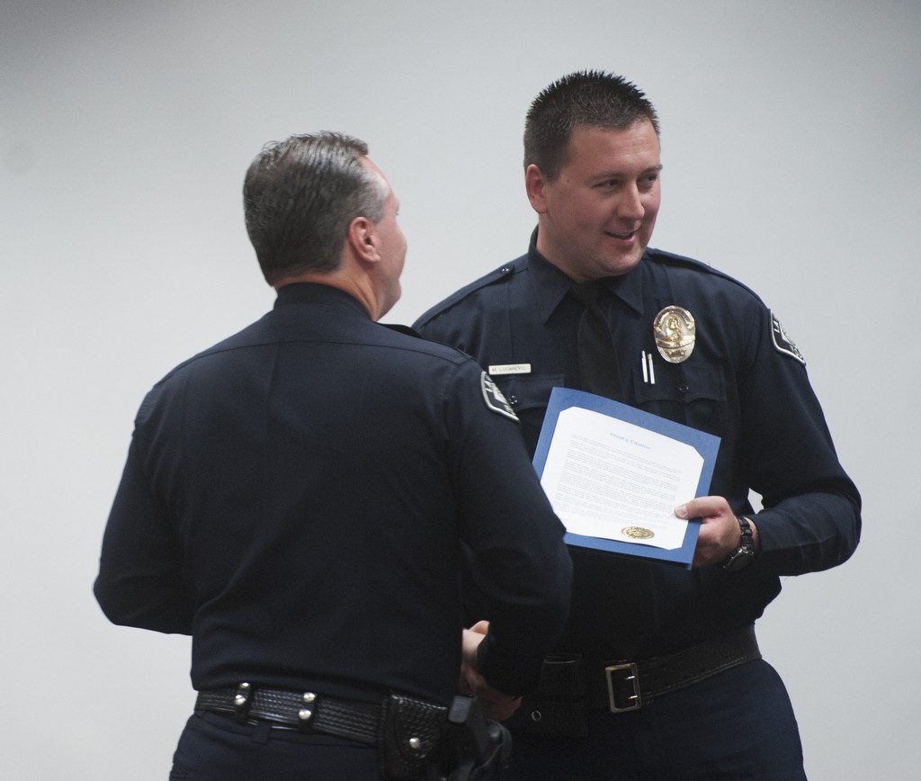 La Habra Police Officer Muris Lucarevic is presented with the Chief's Citation by Chief Jerry Price for his work as homeless liaison during the  2016 Awards ceremony. Photo by Miguel Vasconcellos/Behind the Badge OC 