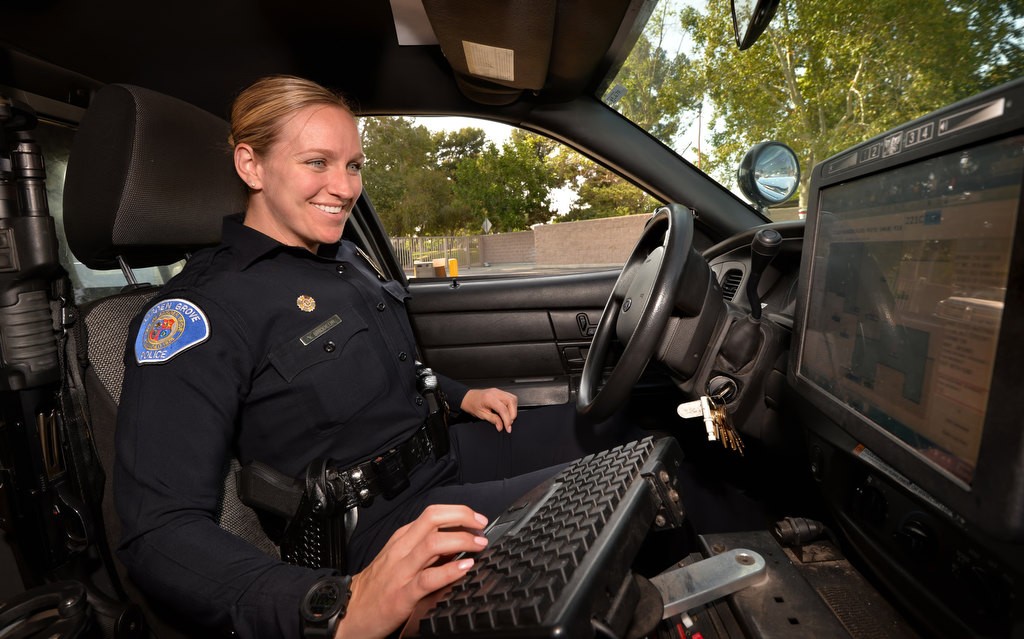Garden Grove Officer Vanessa Brodeur demonstrates the use of the new Spillman computer software in police cars. Photo by Steven Georges/Behind the Badge OC