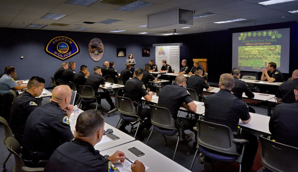 Lisa Lewis, of AnaheimÕs ChiefÕs Neighborhood Advisory Council, talks to Anaheim PD officers before their free lunch for Law Enforcement Appreciation Week. Photo by Steven Georges/Behind the Badge OC
