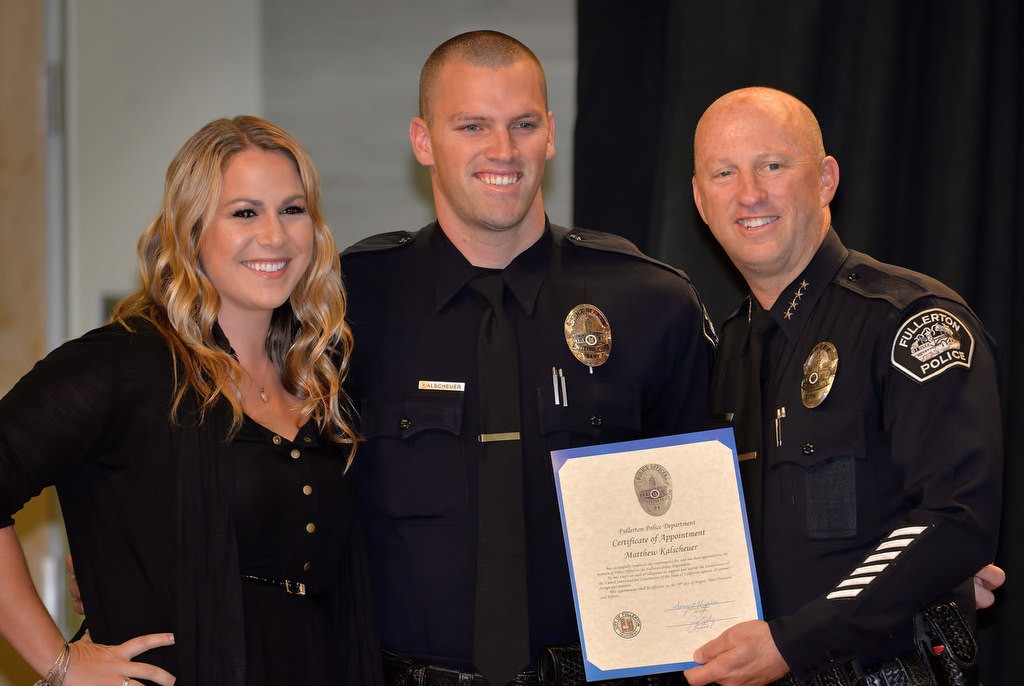 Matthew Kalscheuer stands with his fiancée, Kristen, and Chief Dan Hughes as a new Fullerton police officer. Photo by Steven Georges/Behind the Badge OC
