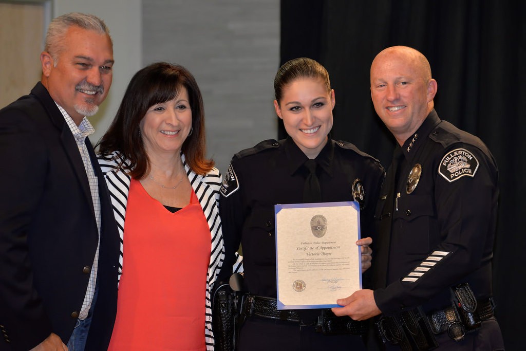 Fullerton’s new Police Officer Victoria Thayer with Chief Dan Hughes and her parents, retired Orange PD Lieutenant Patrick Thayer, and her mother Susan. Photo by Steven Georges/Behind the Badge OC