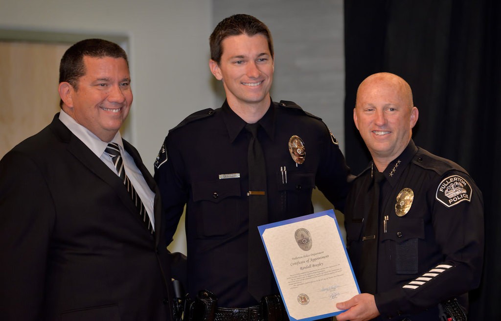 Fullerton’s new Police Officer Randall Brayley with his father Gary and Chief Dan Hughes. Photo by Steven Georges/Behind the Badge OC