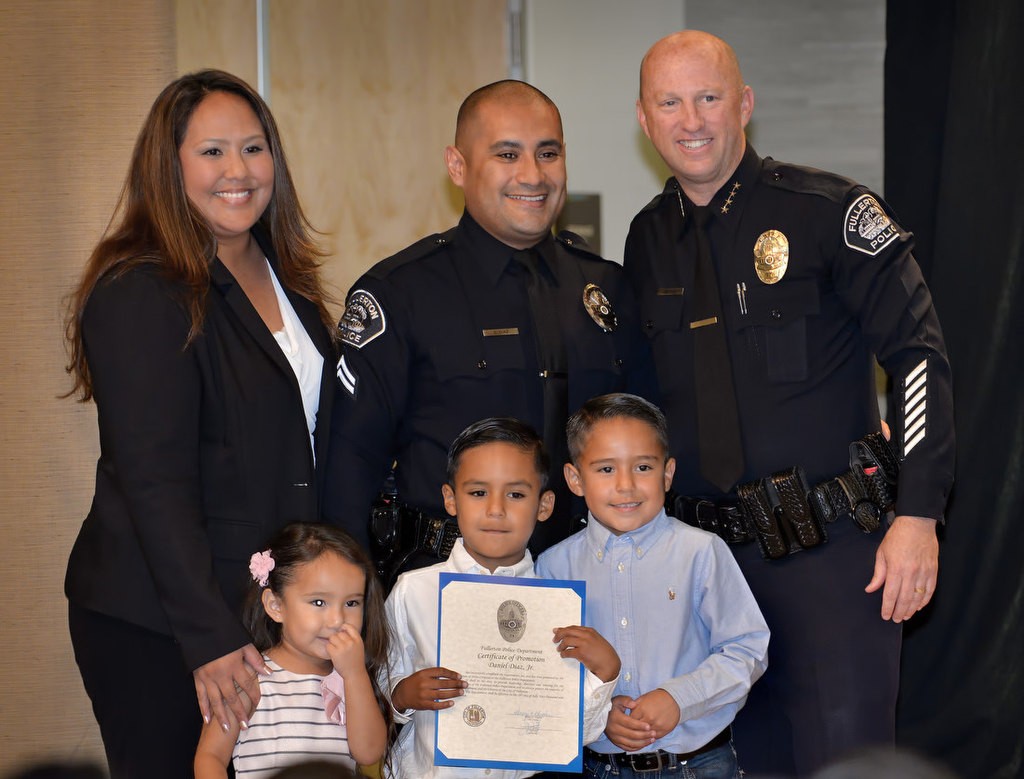 Daniel Diaz is promoted as Fullerton PD’s new Corporal as he stands with Chief Dan Hughes and his family. Photo by Steven Georges/Behind the Badge OC