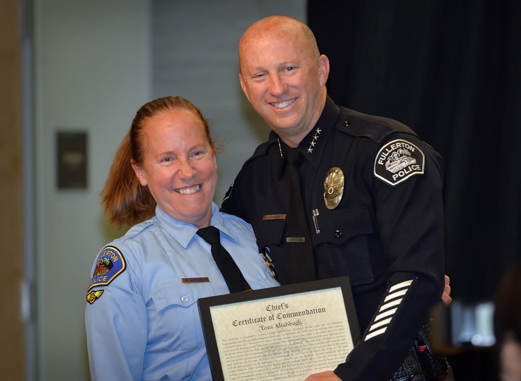 Fullerton PCO Toni Alsabaugh receives the Chief’s Certificate of Commendation from Chief Dan Hughes for her efforts during a shooting in Fullerton. Photo by Steven Georges/Behind the Badge OC