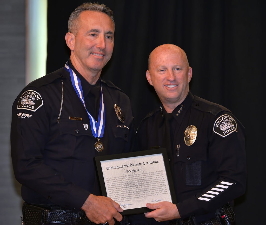 Officer Eric Franke receives the Distinguished Service Medal from Chief Dan Hughes for his work with the Fullerton PD Drug Recognition Expert (DRE) Program. Photo by Steven Georges/Behind the Badge OC