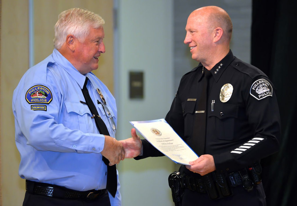 Anthony Package is congratulated by Chief Dan Hughes as he is recognized for joining the FPD RSVP program. Photo by Steven Georges/Behind the Badge OC