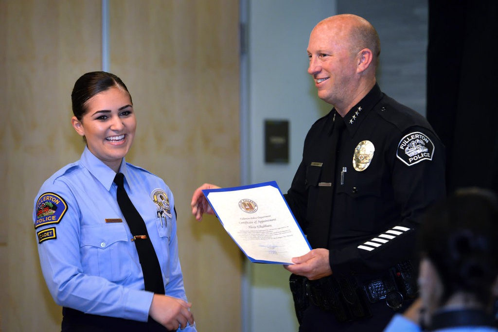 Alexa Elkabarra is congratulated by Chief Dan Hughes as she is recognized for joining the FPD Cadet program. Photo by Steven Georges/Behind the Badge OC