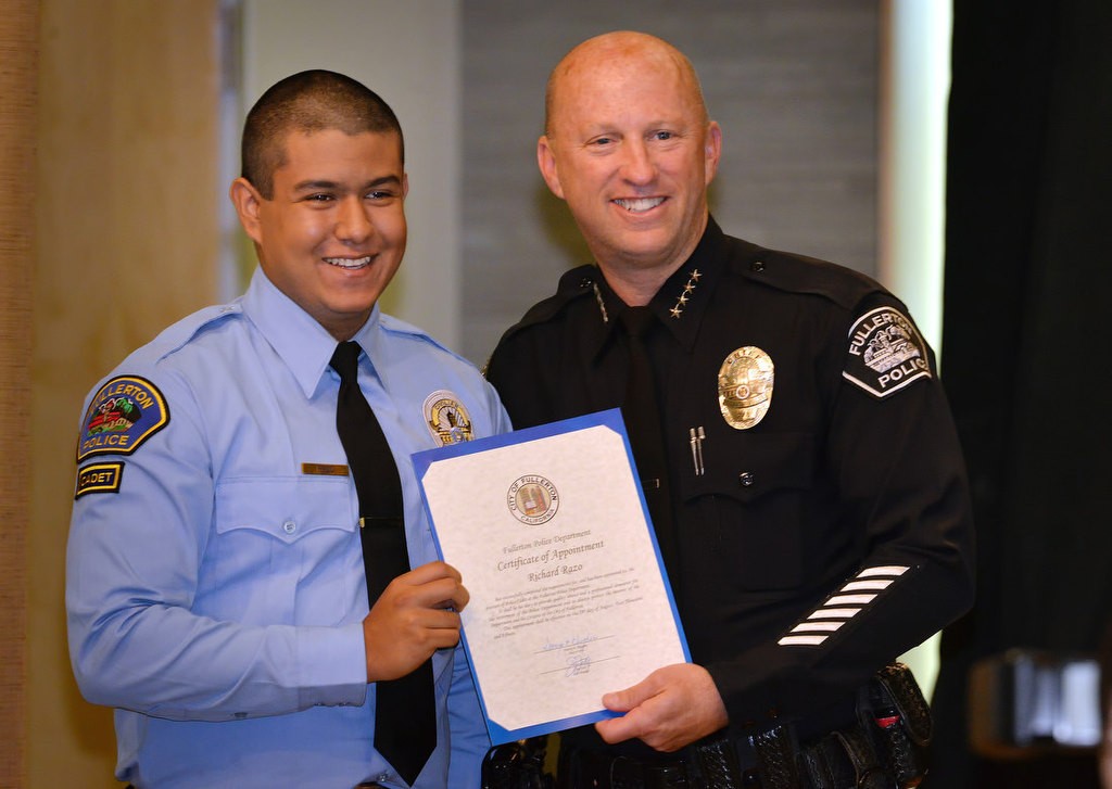 Richard Razo with Chief Dan Hughes as he is recognized for joining the FPD Cadet program. Photo by Steven Georges/Behind the Badge OC