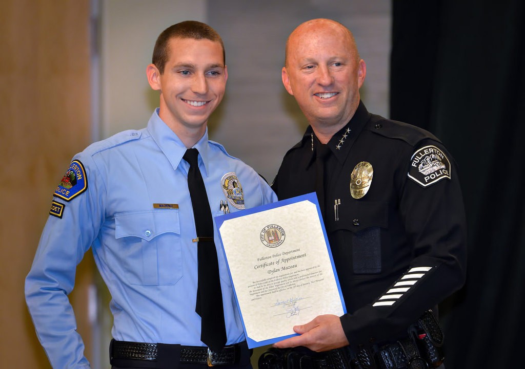 Dylan Mazeau with Chief Dan Hughes as he is recognized for joining the FPD Cadet program. Photo by Steven Georges/Behind the Badge OC