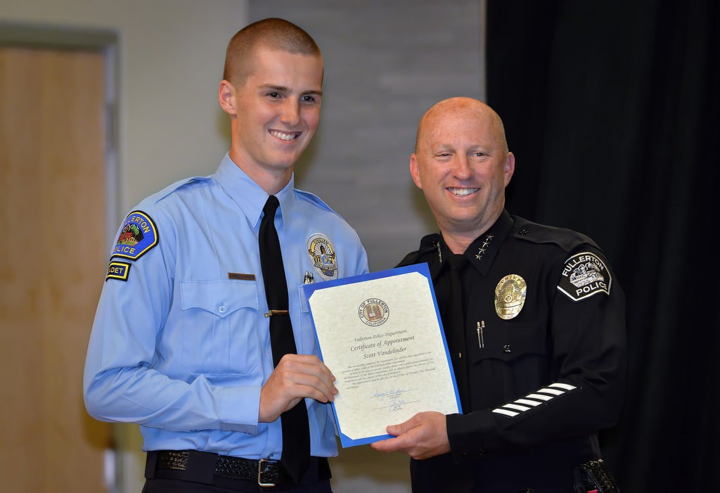 Scott Vandelinder with Chief Dan Hughes as he is recognized for joining the FPD Cadet program. Photo by Steven Georges/Behind the Badge OC