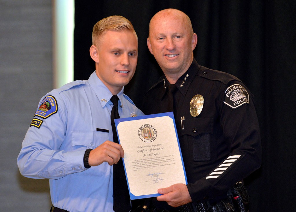 Austin Niegsch with Chief Dan Hughes as he is promoted to the rank of Senior Police Cadet. Photo by Steven Georges/Behind the Badge OC