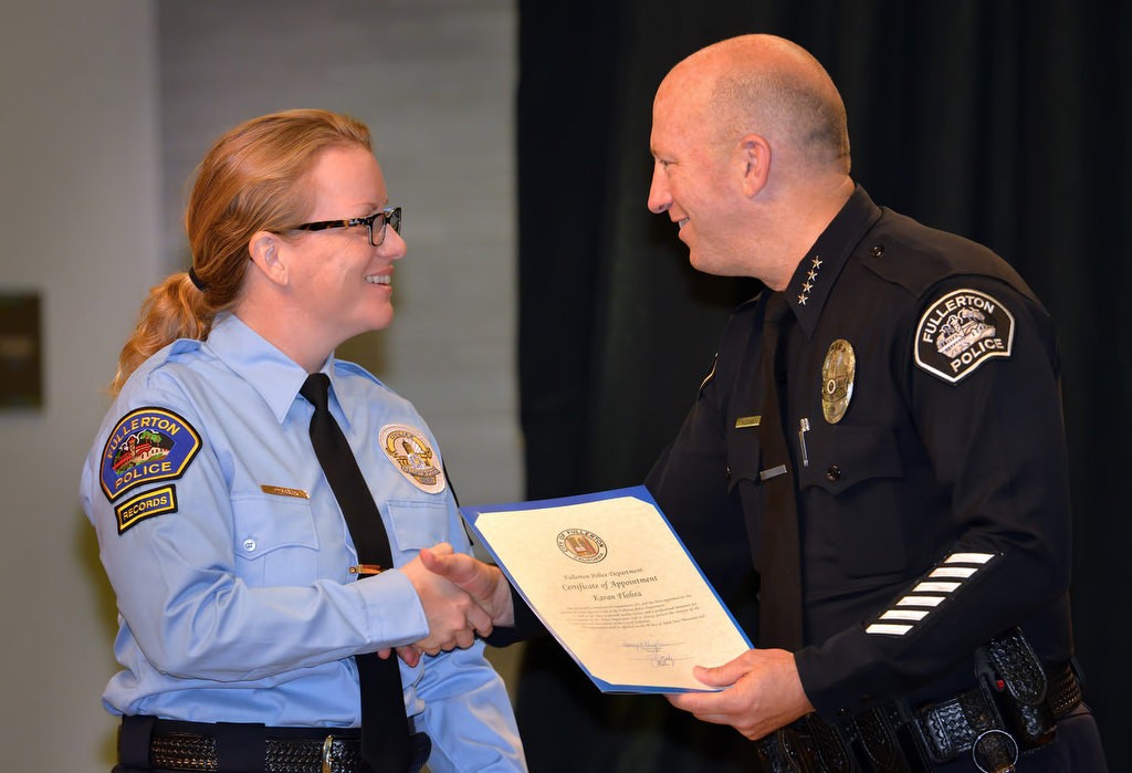 Karan Flohra is congratulated by Chief Dan Hughes for joining the FPD as a Police Records Clerk. Photo by Steven Georges/Behind the Badge OC
