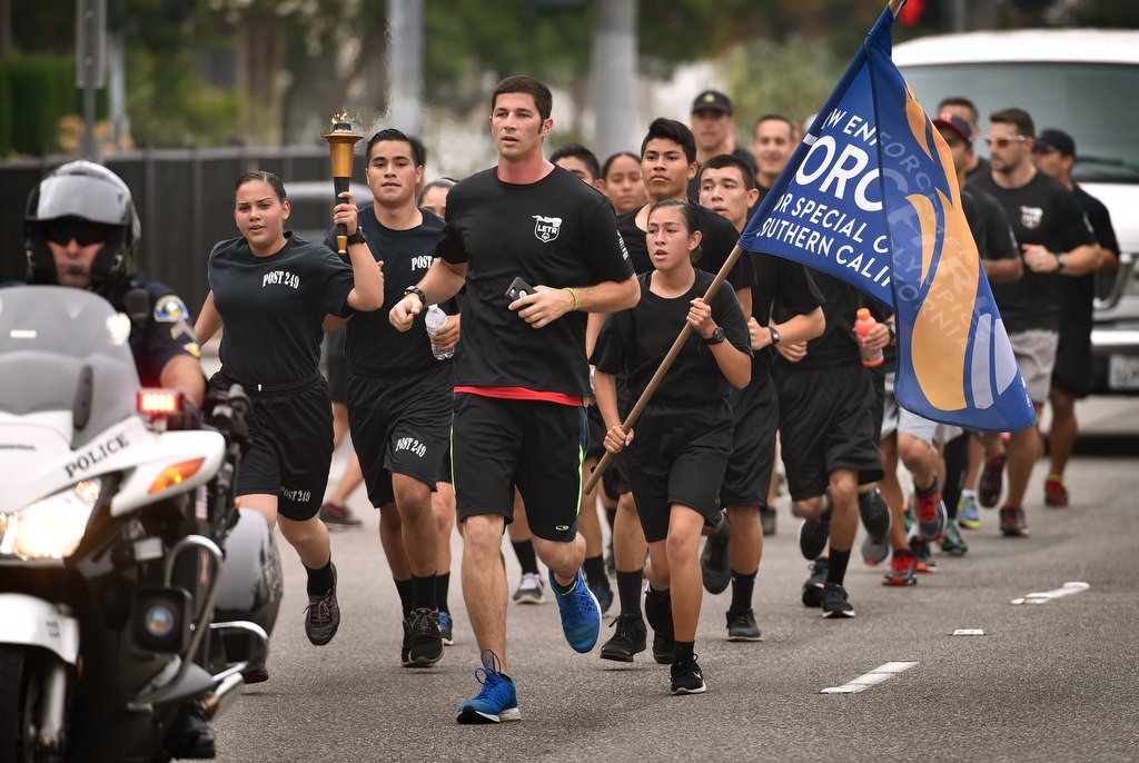 Anaheim Police Explorers from Post 249, Anaheim PD officers and Special Olympians run up Harbor Blvd. during the Law Enforcement Torch Run for Special Olympics of Southern California. Photo by Steven Georges/Behind the Badge OC