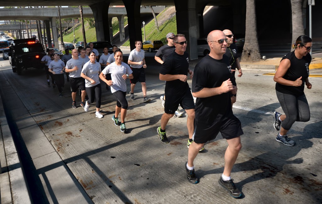 Fullerton Police Chief Dan Hughes runs up Harbor Blvd. before Santa Fe Ave. with other members of the Fullerton PD and Special Olympians during the Law Enforcement Torch Run for Special Olympics of Southern California. Photo by Steven Georges/Behind the Badge OC