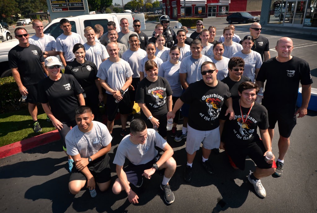 Members of the Fullerton PD, FPD Cadets and Special Olympians gather after running through Fullerton for the Law Enforcement Torch Run for Special Olympics of Southern California. Photo by Steven Georges/Behind the Badge OC