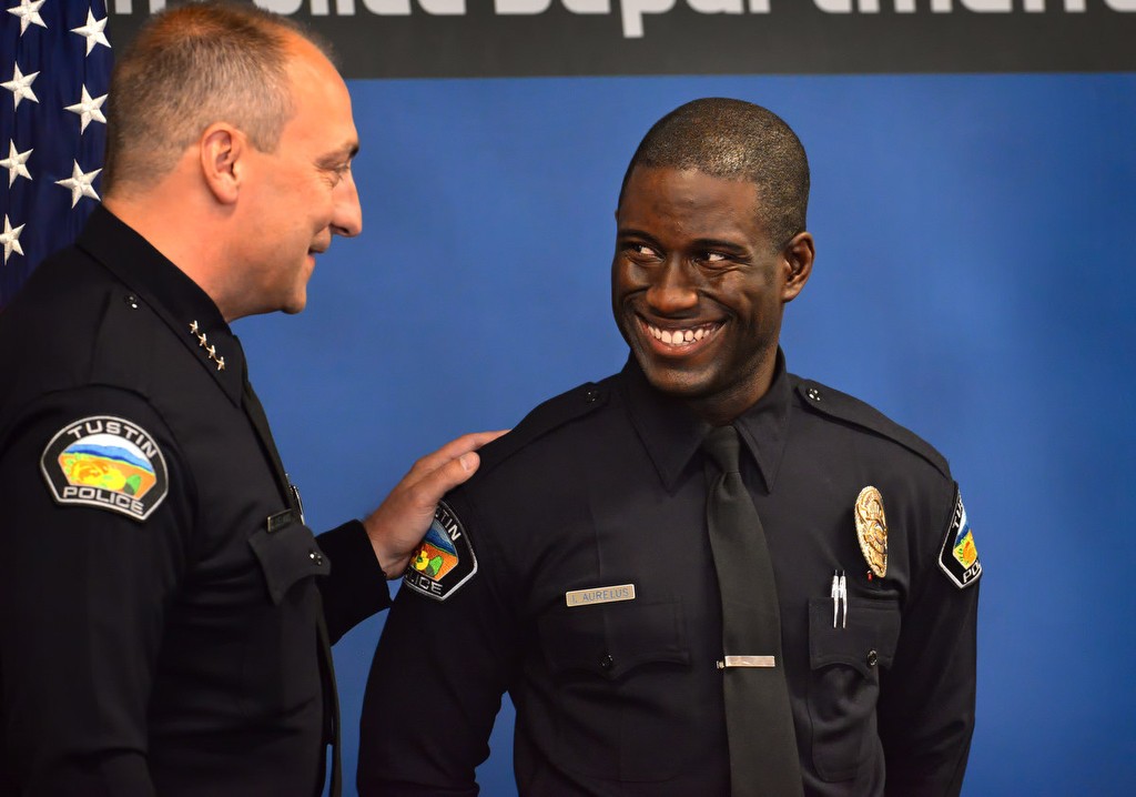 Tustin Police Chief Charles Celano introduces Tustin PD's new officer, Ismael Aurelus, during a small Tustin PD ceremony after the Orange County Sheriff's Regional Training Academy graduation ceremony. Photo by Steven Georges/Behind the Badge OC