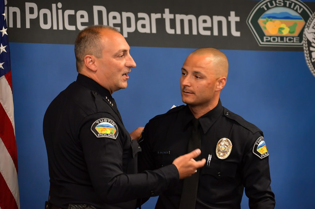 Tustin Police Chief Charles Celano introduces Tustin PD's new officer, David Valencia, during a small Tustin PD ceremony after the Orange County Sheriff's Regional Training Academy graduation ceremony. Photo by Steven Georges/Behind the Badge OC