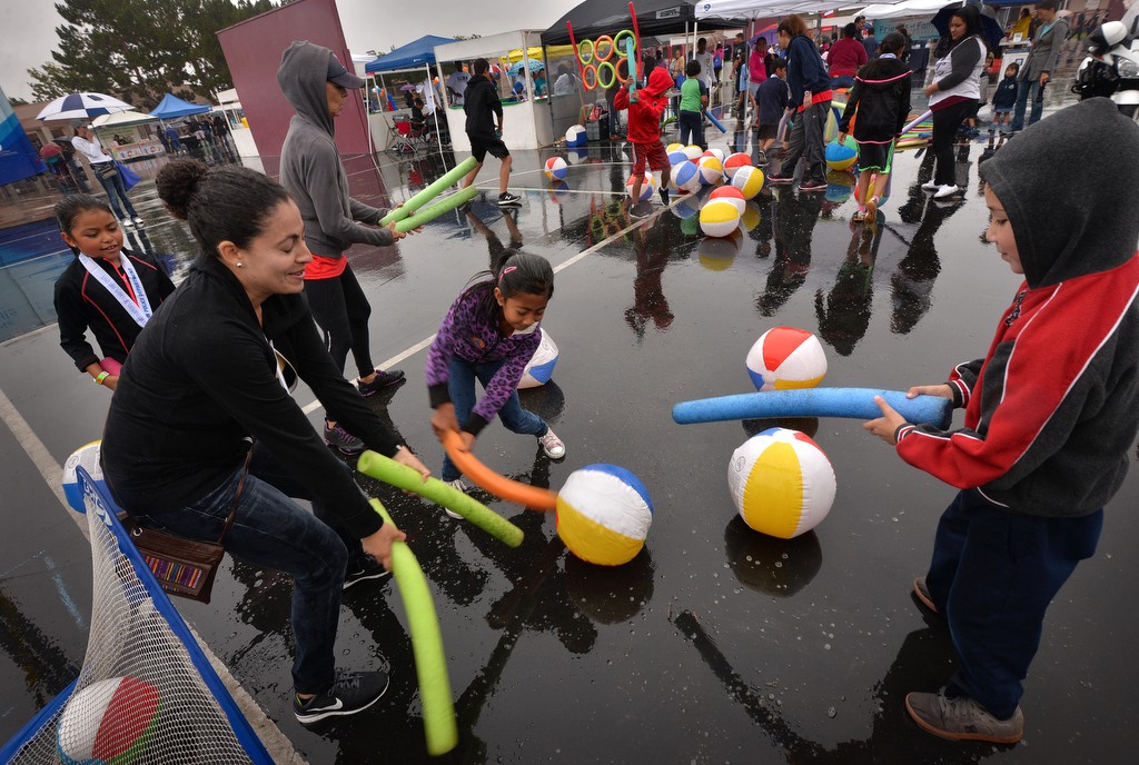 Kids have fun even with the rain coming down during Tustin PD’s Run Club at Robert Heideman Elementary. Photo by Steven Georges/Behind the Badge OC