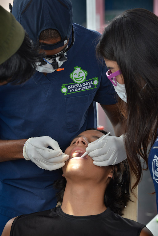 Eddie Garcia, 16, of Tustin receives a free dental screening at the Dental Care for Children booth during Tustin PD’s Run Club at Robert Heideman Elementary. Photo by Steven Georges/Behind the Badge OC