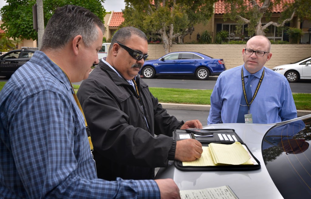 Deputy Scott Ferraro of the OCSD, left, with Deputy Alejandro Salceda and Sgt. Todd Russ in Long Beach trying to track down a suspect. Photo by Steven Georges/Behind the Badge OCz