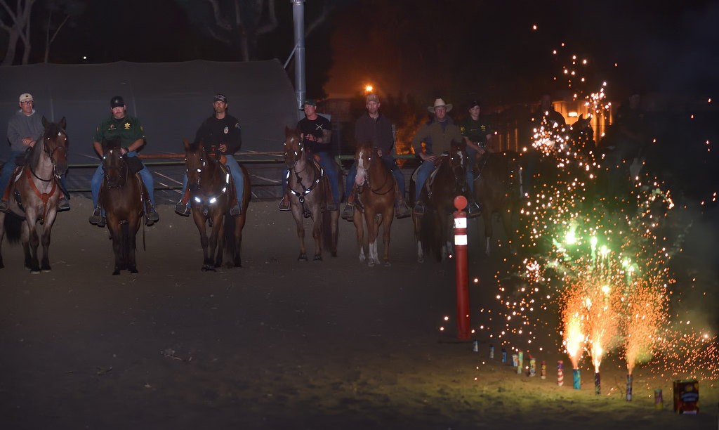 Fireworks, confiscated by police from various agencies throughout Orange County, are put to good use by setting them off near police horses during a training exercise at the James A. Musick Facility in Irvine in order to desensitize the horses so they don’t panic when faced with fireworks out in public. Photo by Steven Georges/Behind the Badge OC