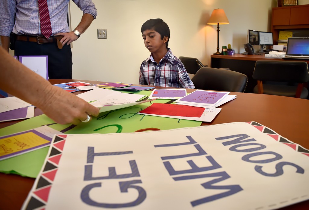 Siva Pelluru, 13, is presented with hand made get well cards from his classmates as he makes his first visit back to Pioneer Middle School in Tustin after collapsing at the school in full arrest. Photo by Steven Georges/Behind the Badge OC