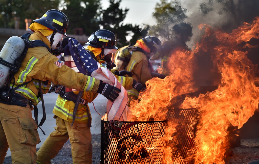 Anaheim Fire & Rescue cadets line up to properly dispose American flags according to tradition during a flag burning ceremony in Anaheim. Photo by Steven Georges/Behind the Badge OC