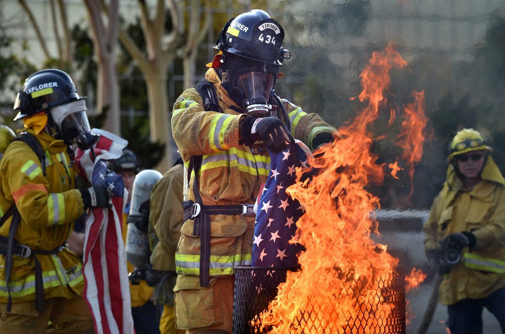 Anaheim Fire & Rescue cadets line up to properly dispose American flags according to tradition during a flag burning ceremony at the North Net Fire Training Center in Anaheim. Photo by Steven Georges/Behind the Badge OC