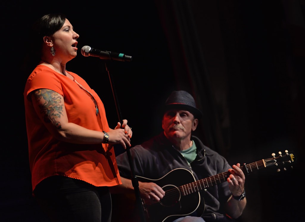 Correctional Officer Abigail Vasquez sings a special song dedicated to APD’s retirees with retired APD Detective Bruce Linn on guitar. Photo by Steven Georges/Behind the Badge OC