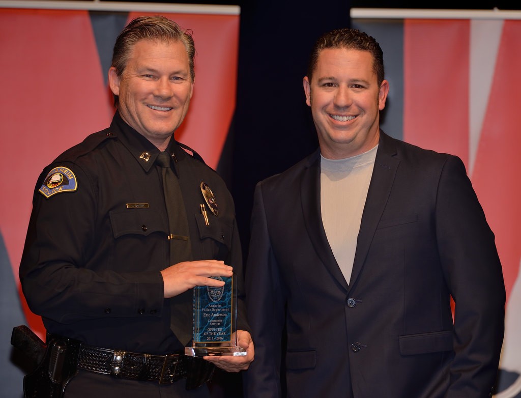 Officer Eric Anderson, right, receives the Community Services Officer of the Year from APD Capt. Eric Carter. Photo by Steven Georges/Behind the Badge OC