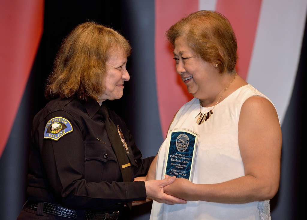 Office Specialist Evelyna Lazo, right, receives the Support Services Division Employee of the Year from Commander Shelley McKerren. Photo by Steven Georges/Behind the Badge OC