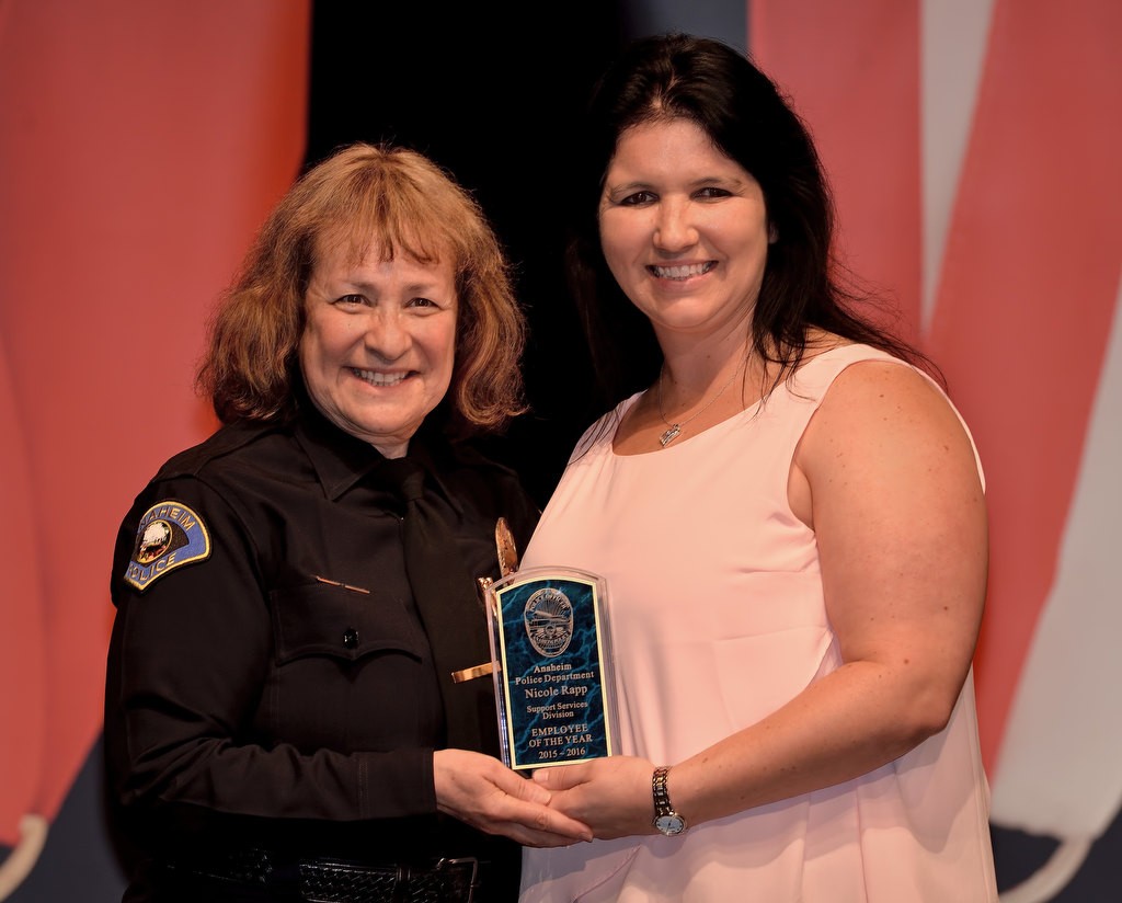 Senior Property and Evidence Technician Nicole Rapp, right, receives the Support Services Division Employee of the Year award from Commander Shelley McKerren. Photo by Steven Georges/Behind the Badge OC