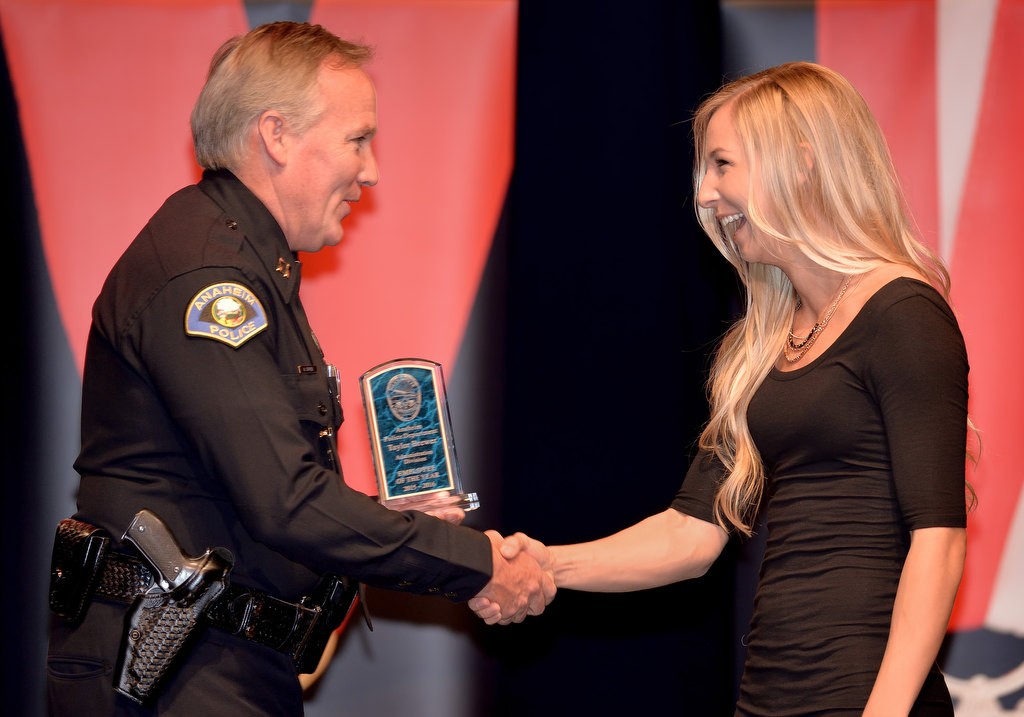 Police Cadet Taylor Brewer, right, receives the Administration Division Employee of the Year award from APD Capt. Mark Cyprien. Photo by Steven Georges/Behind the Badge OC