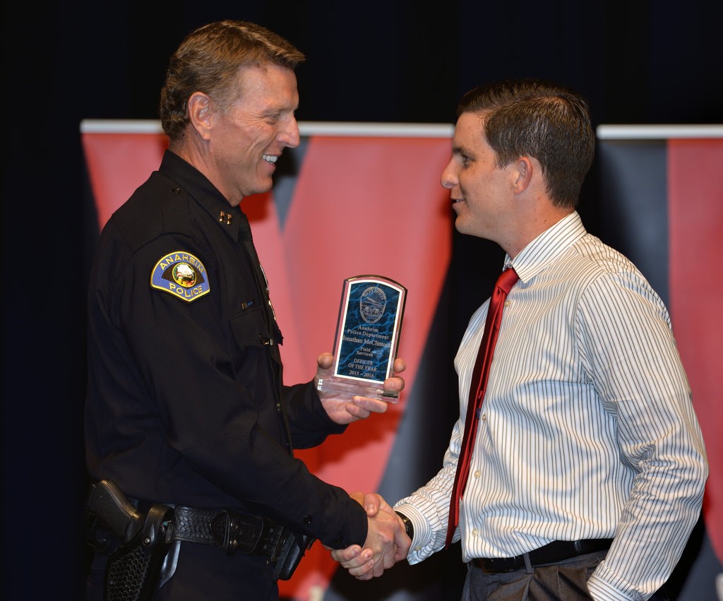 APD Officer Jonathan McClintock, right, receives the Officer of the Year award from Capt. Steve Marcin. Photo by Steven Georges/Behind the Badge OC