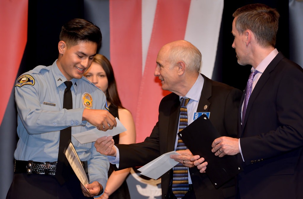 APD Explorer Hector Martinez receives the Dr. Alice Grant Scholarship Award from Glenn Miller and Ryan Hawkins, right. Photo by Steven Georges/Behind the Badge OC