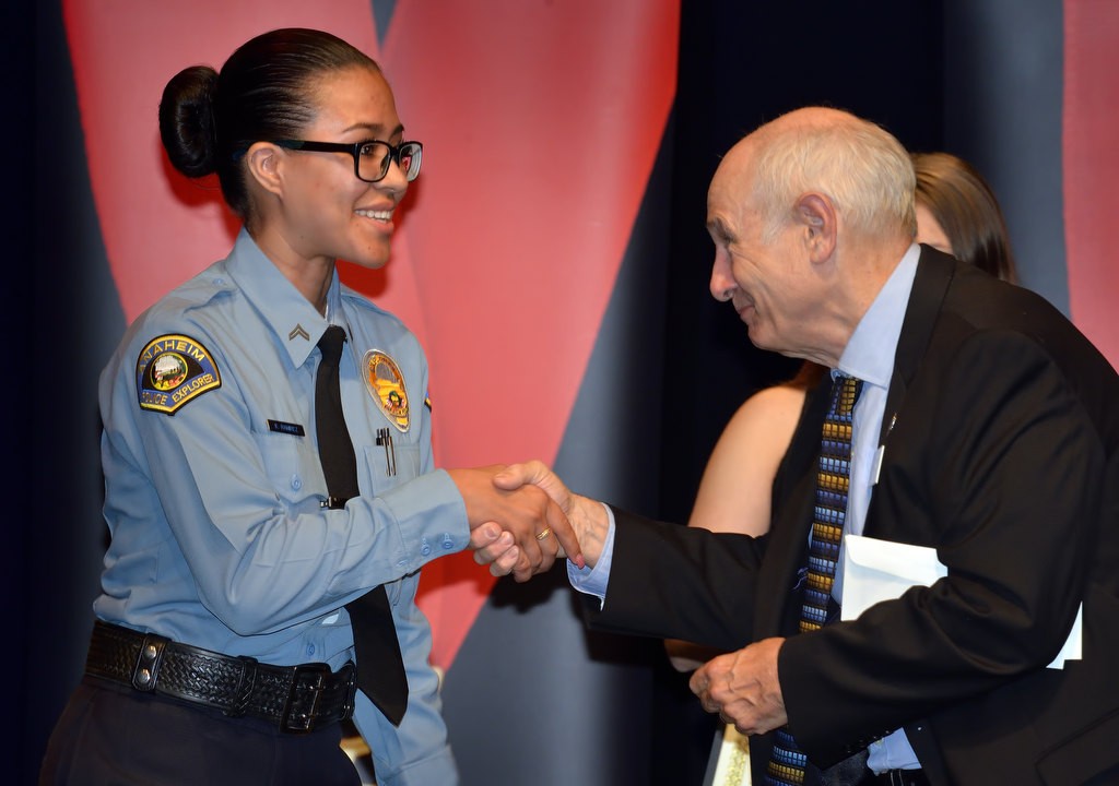 APD Explorer Karla Ramirez Lopez receives the Dr. Alice Grant Scholarship Award from Glenn Miller. Photo by Steven Georges/Behind the Badge OC