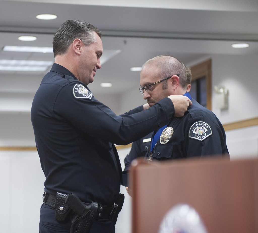 Reserve Officer Joshua Goldmark is recognized for 20 years of service with a Career Service Medal from Chief Jerry Price during the La Habra Police Department 2016 Awards ceremony.  Photo by Miguel Vasconcellos/Behind the Badge OC 