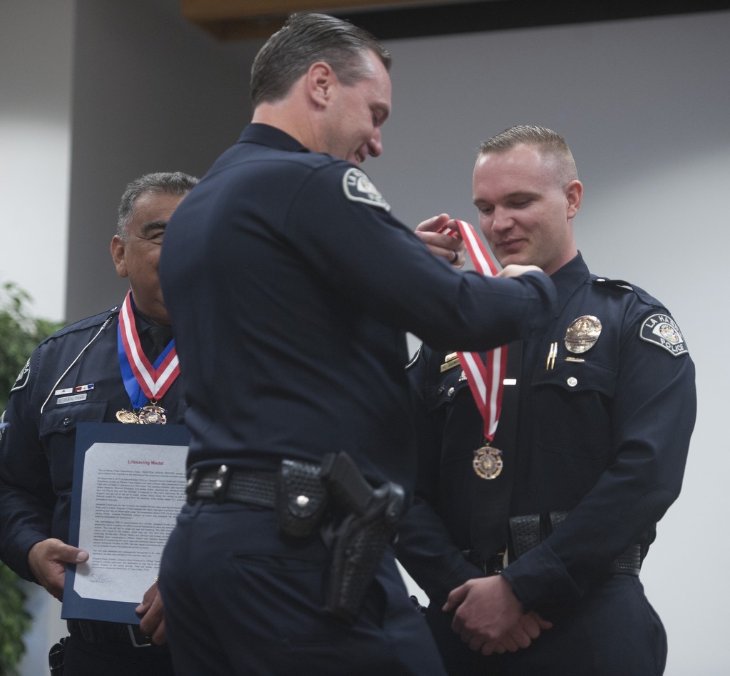 Officer Herb Johnson is recognized with the Lifesaving Medal by Chief Jerry Price during the La Habra Police Department 2016 Awards ceremony. Photo by Miguel Vasconcellos/Behind the Badge OC 