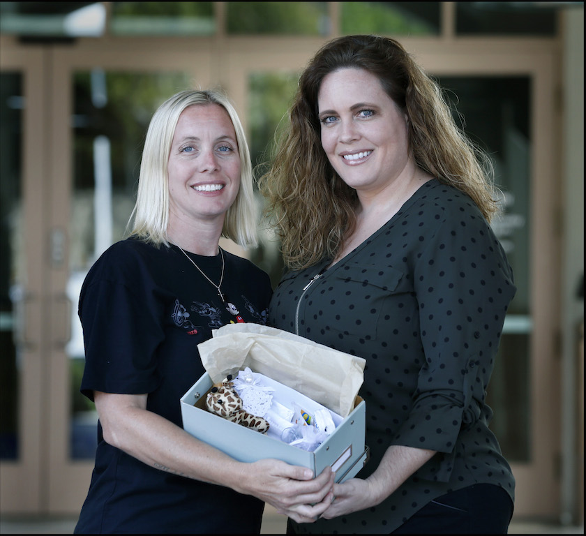 Catherine Avila and her sister Julie Chassagne with one of the gift boxes they made to give to families who have lost a child. Avila's daughter died in a car accident. Photo by Christine Cotter/Behind the Badge OC  