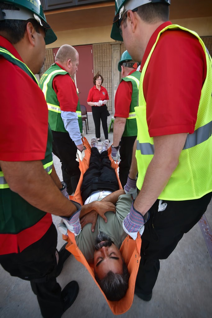 Anaheim CERT volunteer Fernando Dorado is carried to a triage station during a search and rescue drill at Anaheim’s North Net Training Center. Photo by Steven Georges/Behind the Badge OC